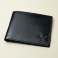 Black leather wallet on a beige background