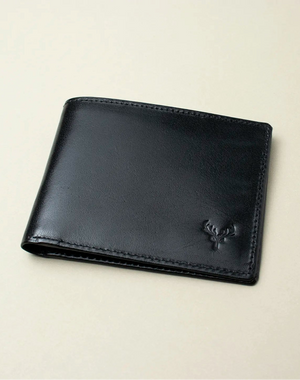 Black leather wallet on a beige background
