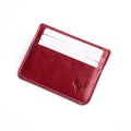 Red cardholder with a brand logo on a white background
