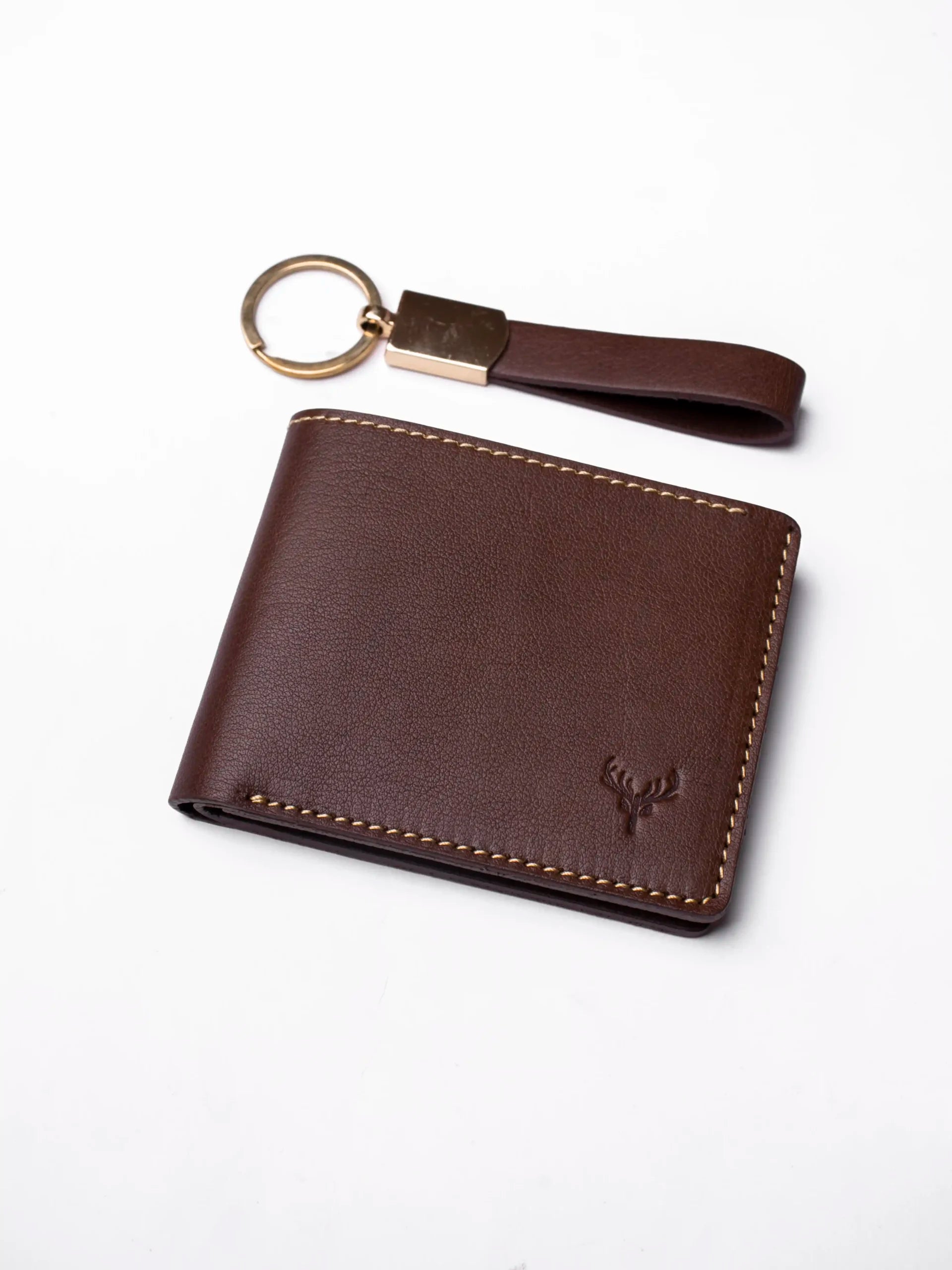 Brown leather wallet with keychain on a white background